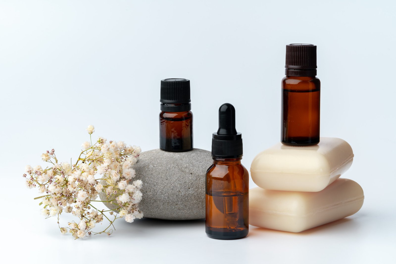 Home spa stones and soap on white background